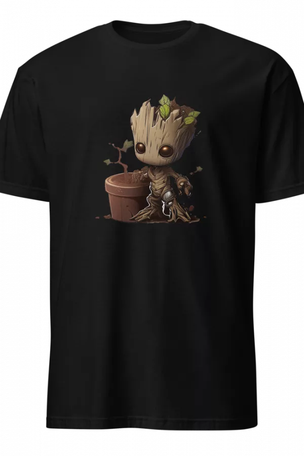 Man wearing a black T-shirt printed with a chibi tree character sitting beside a small sprouting pot. - Black