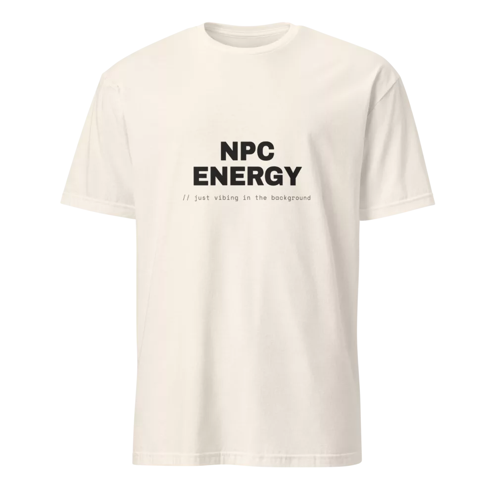 White t-shirt with bold black NPC ENERGY text and a '// just vibing in the background' code caption. - Natural